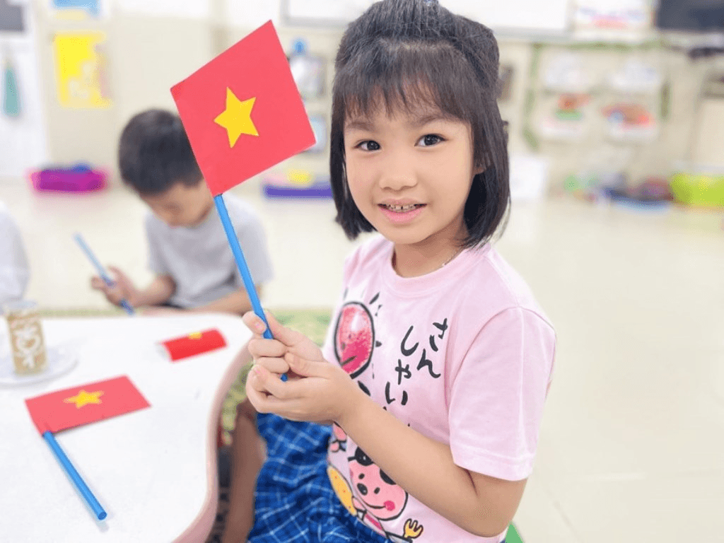 in cờ cầm tay